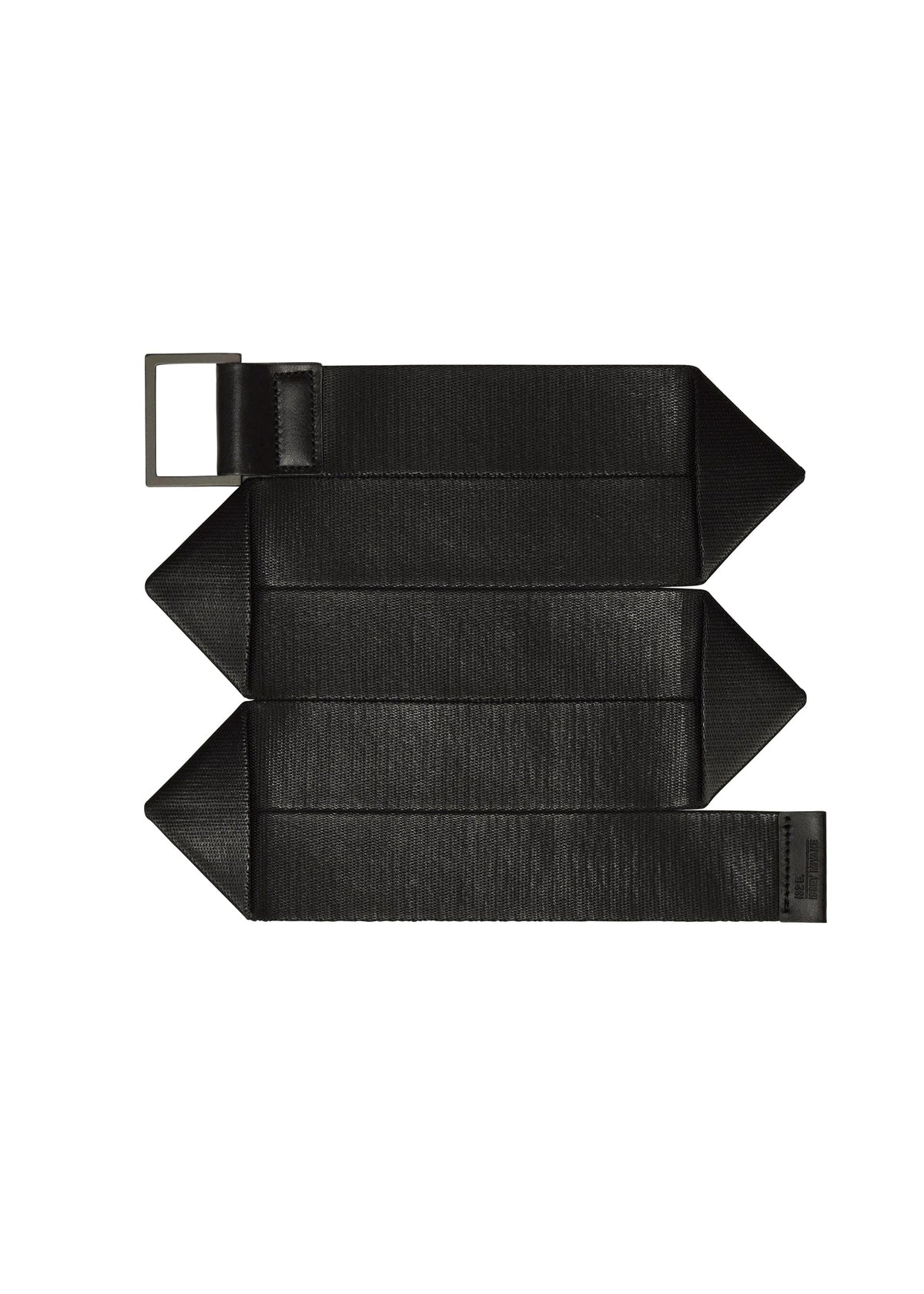 The F-BE belt by 132 5. ISSEY MIYAKE is a wide, black, textured accessory with a unique shape, rectangular metal buckle, and three pointed ends, shown flat on a white background. view 1 of 4