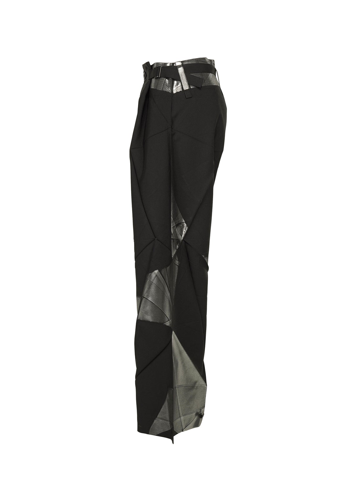 Side view of F-BT pants by 132 5. ISSEY MIYAKE in black recycled polyester, featuring an angular geometric design with shiny metallic silver foil on the waistband and legs, displayed against a white background. view 3 of 13
