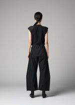 A person with long dark hair, seen from behind, wears the 132 5. ISSEY MIYAKE F-BT black sleeveless top and wide-leg recycled polyester pants with angular seams, paired with black shoes, against a plain light gray background.