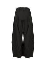 The F-BT pants by 132 5. ISSEY MIYAKE are wide-leg black recycled polyester trousers with geometric paneling, angular seam details, belt loops at the waist, and adjustable snap closures at the hem, shown from the back.