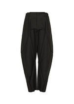 The F-BT pants by 132 5. ISSEY MIYAKE are high-waisted, black, with a wide sculpted silhouette and geometric panels, crafted from recycled polyester. They feature a button closure at the waistband and an ankle-length hem.