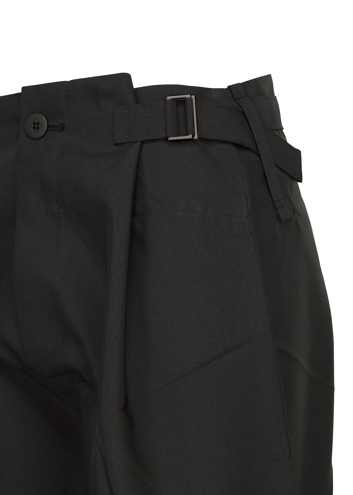 Close-up of F-BT black recycled polyester pants by 132 5. ISSEY MIYAKE, featuring a side adjuster strap with metal buckle, button closure at the waistband, and structured, slightly textured fabric. view 6 of 14