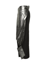 The F-BT skirt by 132 5. ISSEY MIYAKE is a black midi design with an asymmetrical metallic silver overlay featuring geometric lines and subtle foil accents, displayed in a side view against a white background.