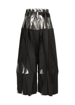 The No.3-1 by 132 5. ISSEY MIYAKE is a black knee-length pleated convertible skirt pant featuring shiny metallic silver panels and angular, structured folds, shown on a plain white background.