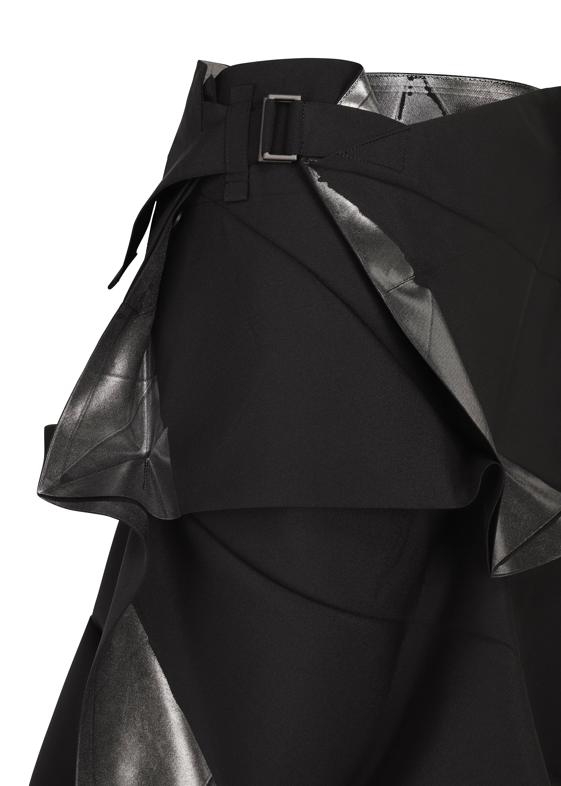 Zoomed view A close-up of the No.1-2 skirt by 132 5. ISSEY MIYAKE showcases its black foil fabric with a silver metallic sheen, featuring layered, angular panels and a black belt with a rectangular buckle. Expertly crafted from recycled polyester, this piece presents an eye-catching flared silhouette that elevates any modern wardrobe.