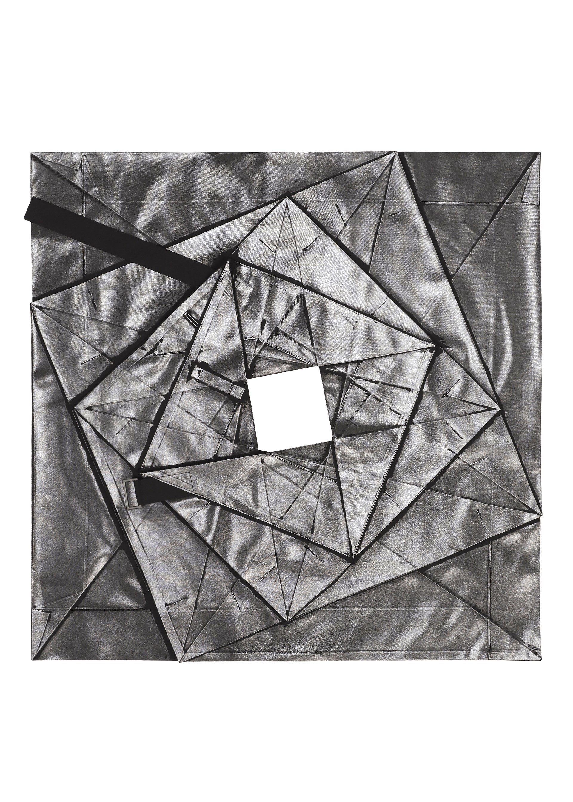 Zoomed view No.1-2 by 132 5. ISSEY MIYAKE is an abstract geometric artwork featuring overlapping metallic silver triangles and rectangles with a central square cutout, set against a white background. Black, ribbon-like elements extend from the shapes, evoking dynamic movement reminiscent of a flared silhouette inspired by a foil skirt.