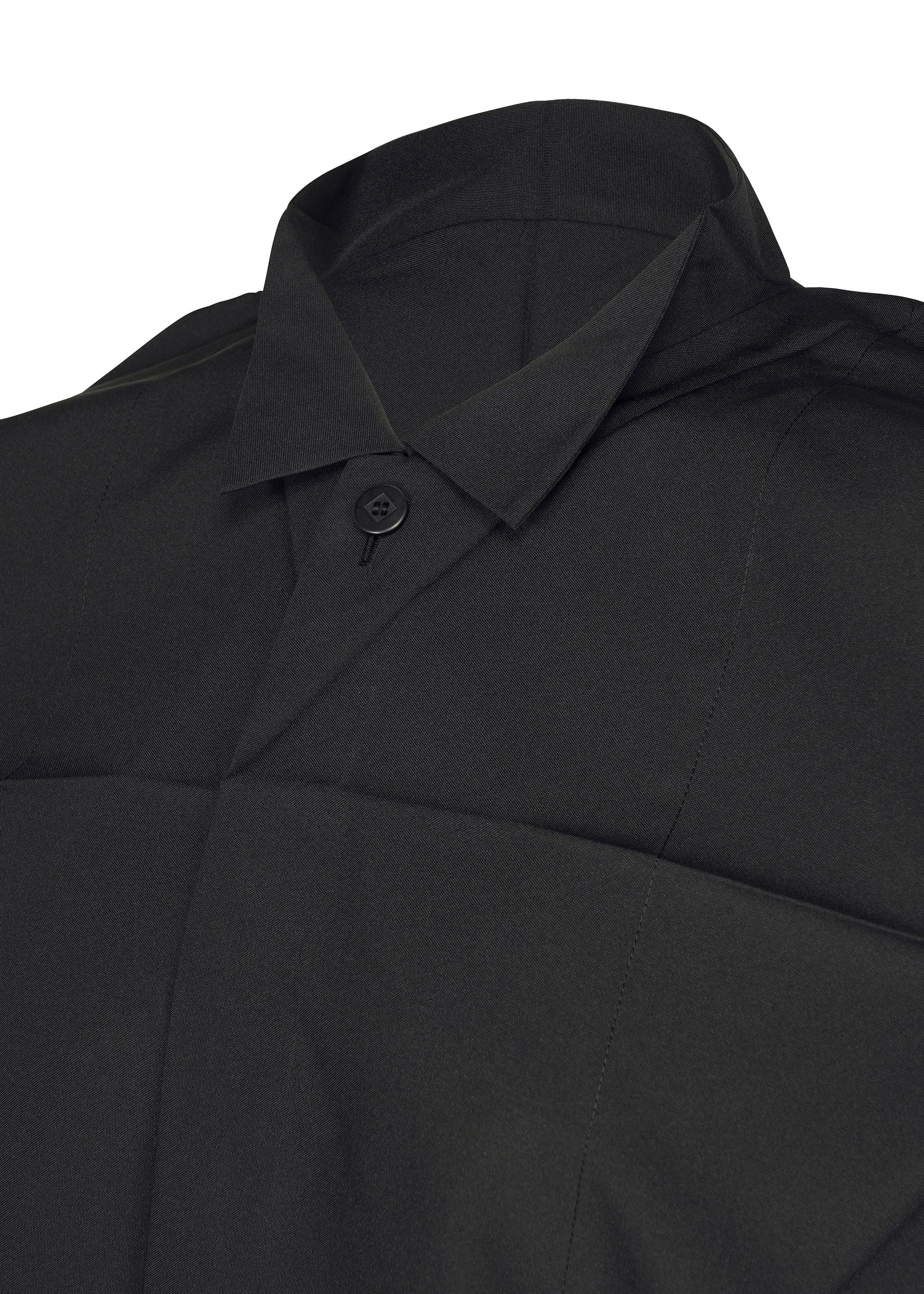 Zoomed view Close-up of the F-SH-2 shirt by 132 5. ISSEY MIYAKE, featuring a black standing collar, a single visible button, and crisp, structured fabric. The shirt appears neatly pressed and formal.