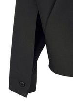 Close-up of the F-SH-2 black long-sleeve shirt by 132 5. ISSEY MIYAKE, crafted from recycled polyester, highlighting the buttoned cuff and a section of the side seam.