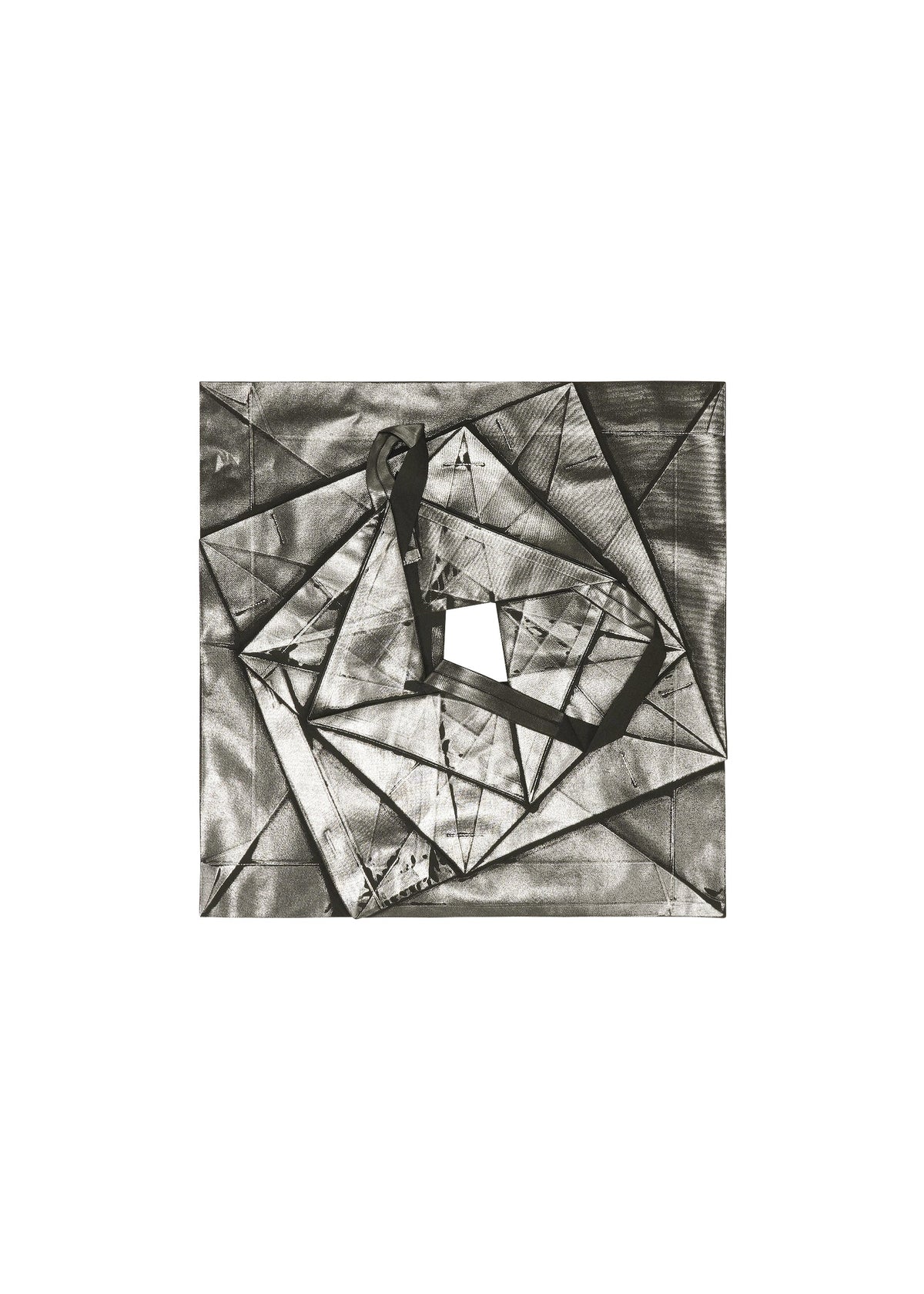 No.1-1 by 132 5. ISSEY MIYAKE: An abstract black and white artwork with overlapping rectangles and triangles, a central square cutout, and a dark ribbon form draped across the geometric pyramid-inspired composition. view 5 of 10