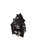 The No.10-2 sculpture by 132 5. ISSEY MIYAKE features abstract, layered angular forms in black, blending matte and glossy finishes that catch the light for a bold, modern statement.