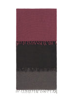 The SLITS STOLE by ISSEY MIYAKE is a rectangular cotton accessory featuring three horizontal color blocks—burgundy, black, and gray—with short fringes on each section for versatile styling. - BLACK-HUED （no.17）