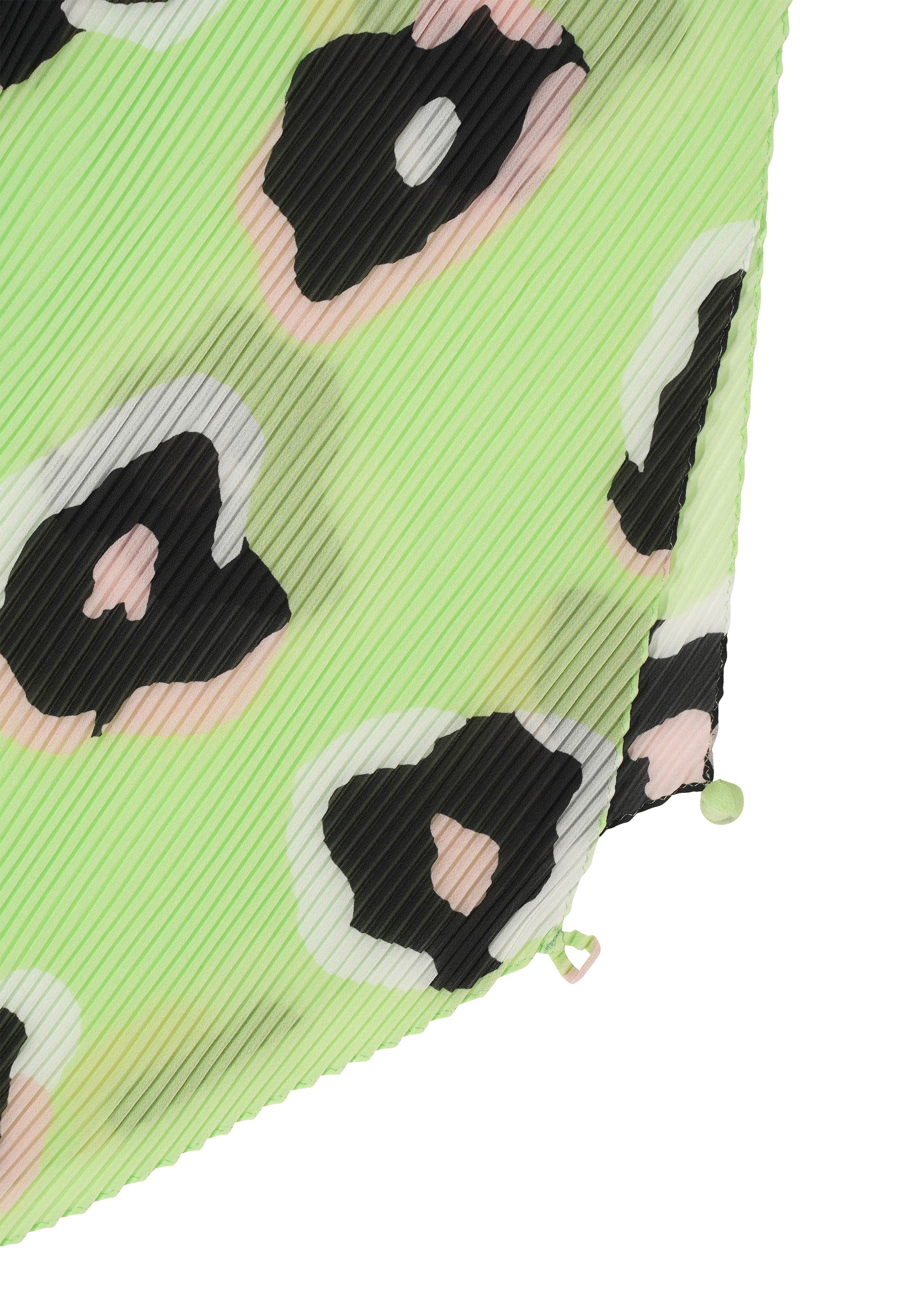 Zoomed view Close-up of the VERVE PLEATS STOLE by ISSEY MIYAKE, showing light green pleated fabric with diagonal ridges and abstract black, white, and pale pink hand-drawn leopard spots. Two small fabric-covered buttons appear at the bottom edge.