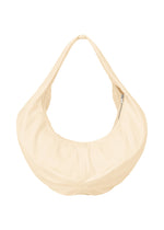 The ISSEY MIYAKE PAPER BALLOON 2 is a beige, crescent-shaped shoulder bag with a crinkled texture, a single wide strap, and a zipper pocket on one side, shown against a plain white background. - EGG BEIGE （no.49）