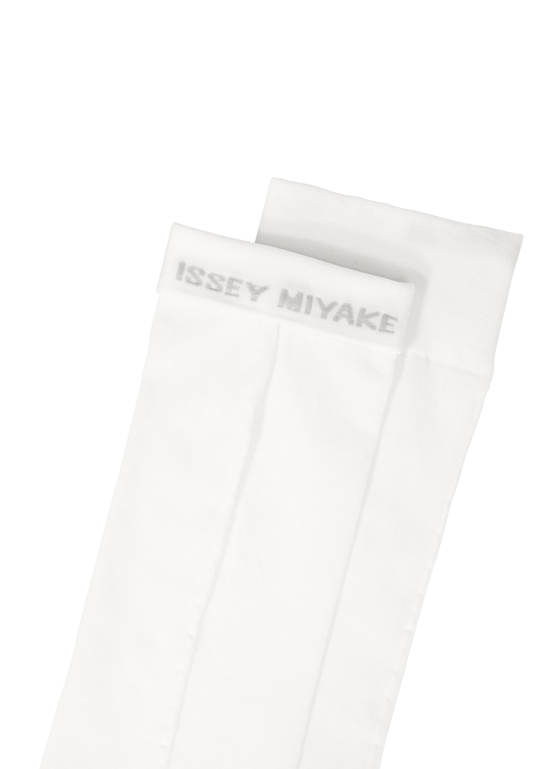 Zoomed view ISSEY MIYAKE SHEER SOCKS in white, featuring a subtle logo in light gray near the top cuff. The socks are neatly folded on a white background.