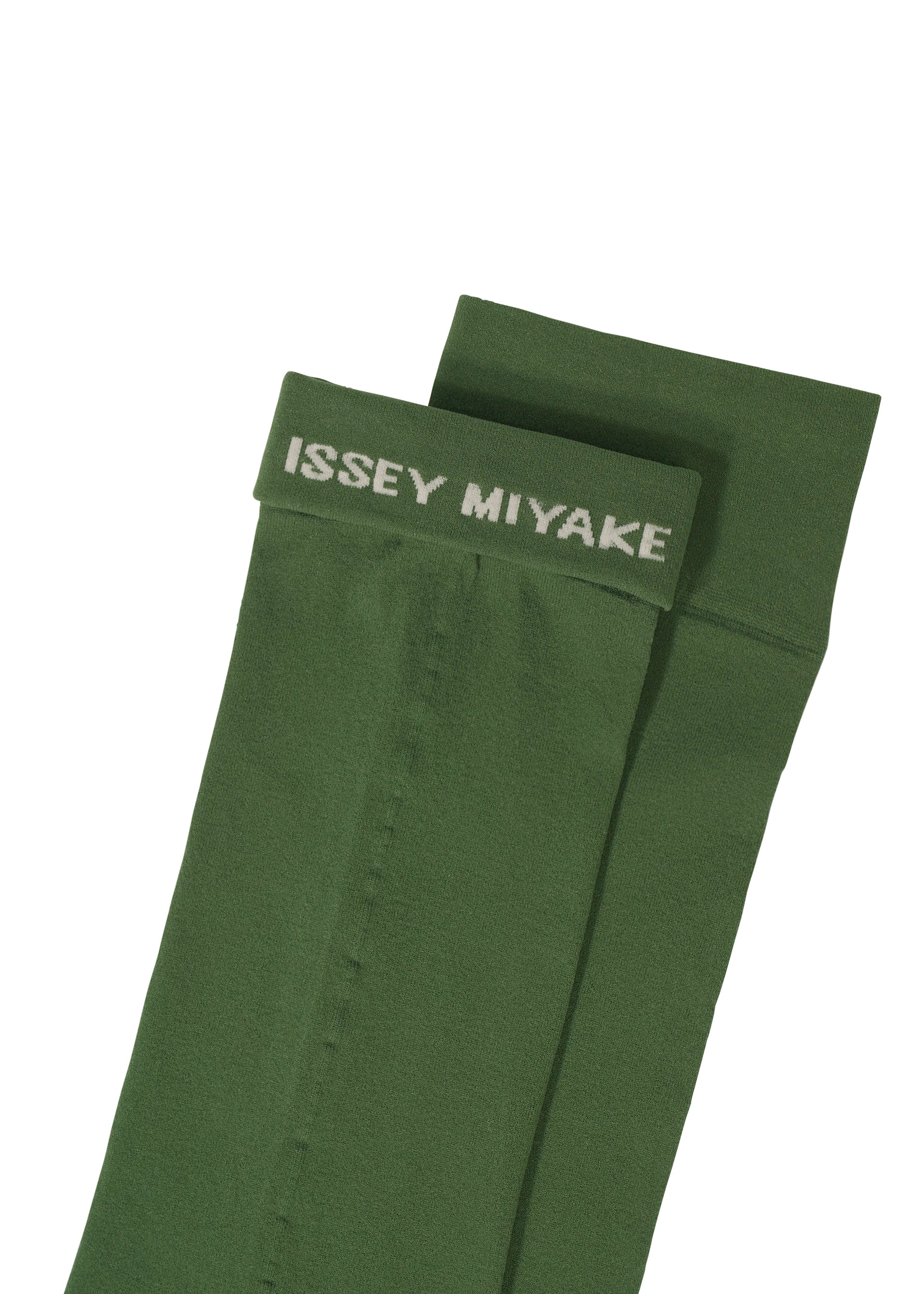 Zoomed view A pair of green SHEER SOCKS by ISSEY MIYAKE, featuring the brand's white logo on the top cuffs, laid flat against a white background.