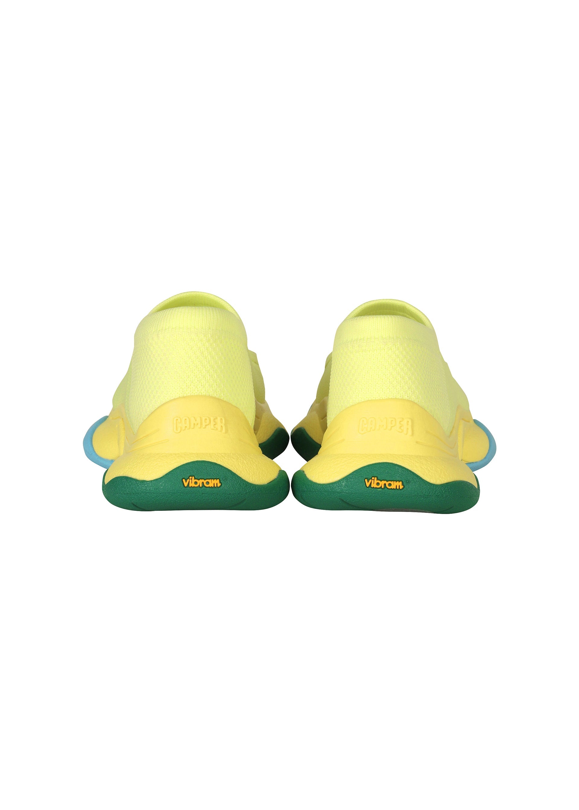 Zoomed view The ISSEY MIYAKE KARST FINCH sneakers feature a yellow upper, green sole, and blue accents, viewed from the back. The brands ISSEY MIYAKE and KARST FINCH appear on the heel and sole, emphasizing their unique, colorful design.