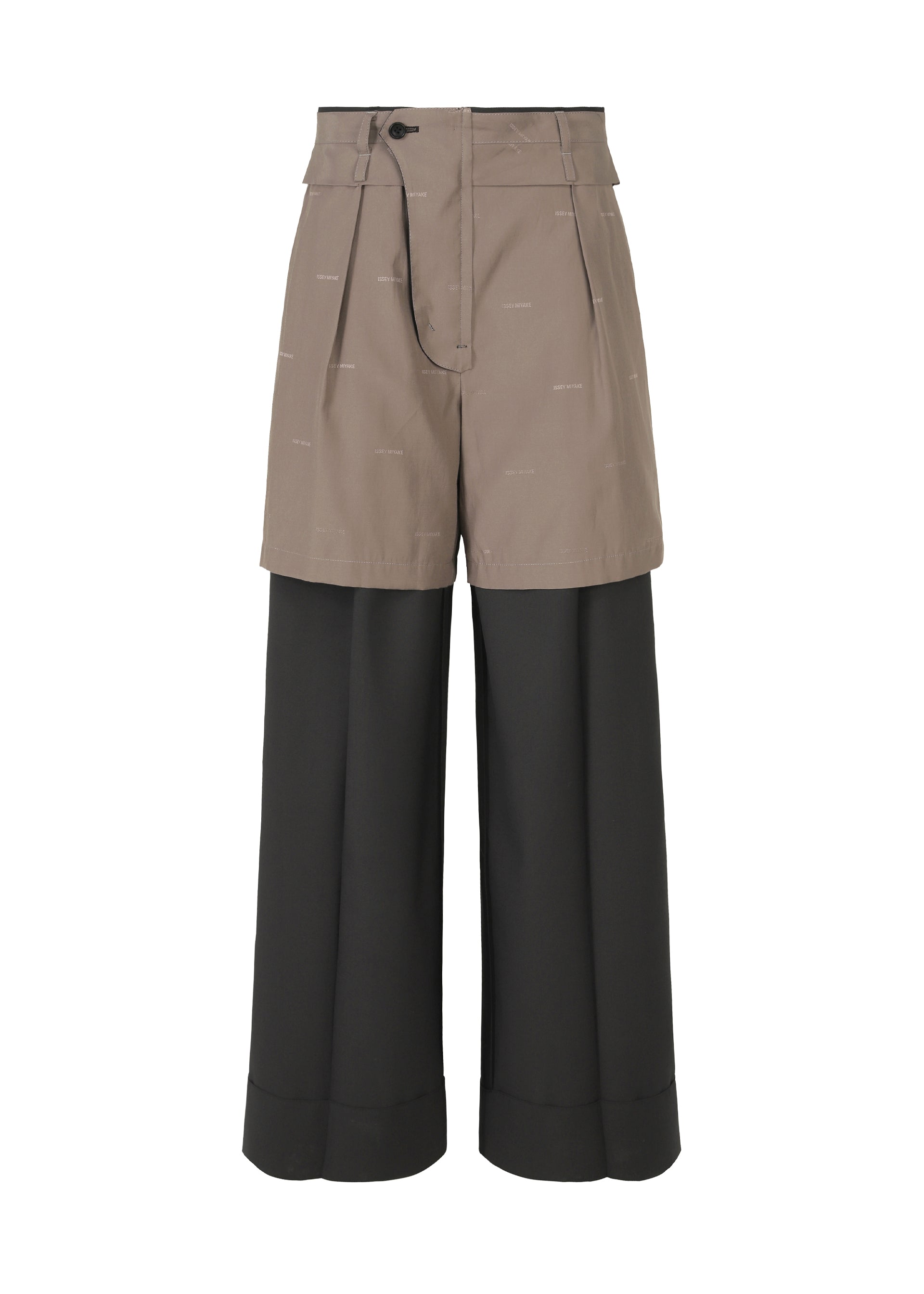 Zoomed view PALINDROME by ISSEY MIYAKE: Black wide-leg, high-waisted pants with an attached tan mini-short overlay, drawstring waist, subtle text on the shorts, cuffed hem, and signature ISSEY MIYAKE-inspired style.
