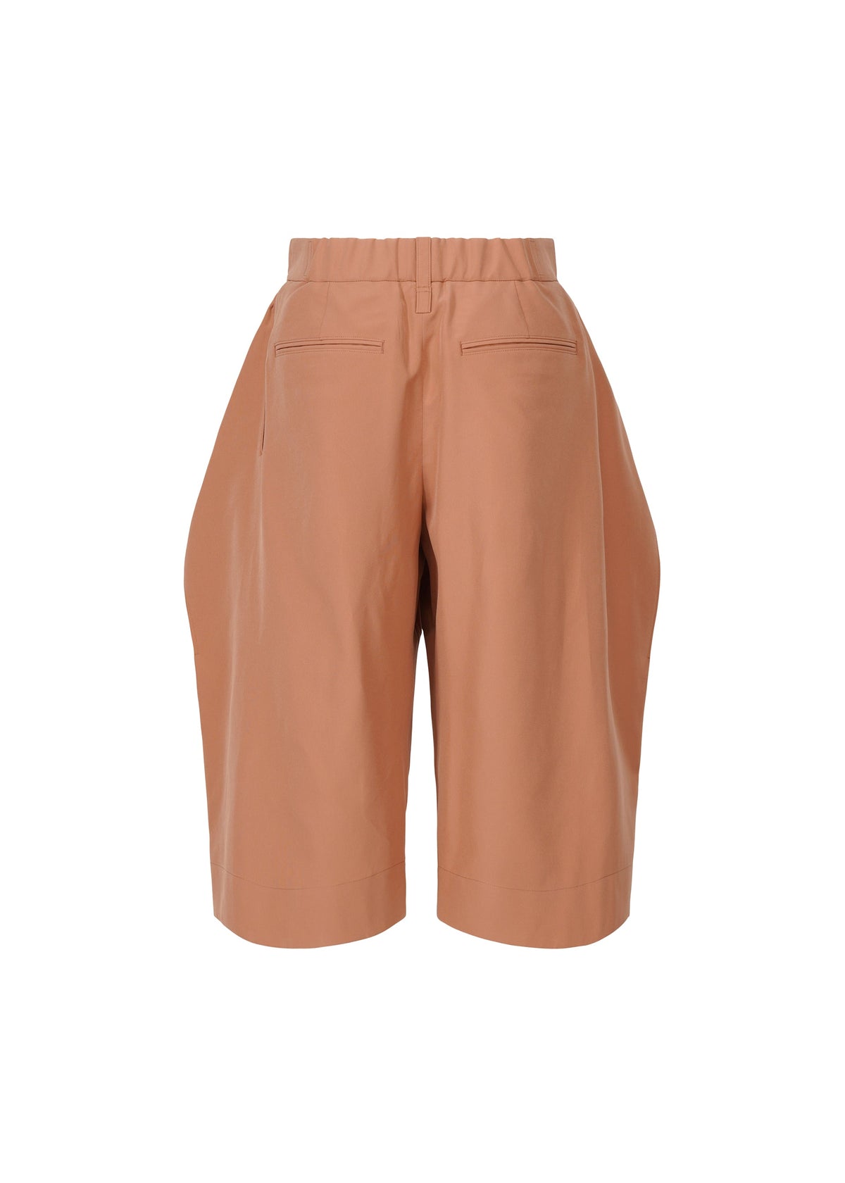 ISSEY MIYAKE FLUTTERING PANTS: High-waisted, knee-length terracotta shorts with elastic waistband, front pleats, back welt pockets, and a subtle matte double-woven texture, shown against a white background. view 3 of 7