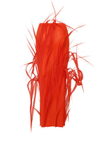 URBAN JUNGLE by ISSEY MIYAKE: A bright red, cylindrical sculptural piece featuring straight and curly spike-like strands in an abstract, dynamic arrangement against a white background.