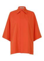 The ISSEY MIYAKE LOOPED shirt is a loose-fitting, short-sleeve, button-up in bright orange with a regular collar and slightly boxy silhouette. - MACAW RED （no.28）