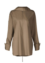 The ODD SHIRT 2 by ISSEY MIYAKE is a light brown, long-sleeve button-up blouse in high-twist cotton voile, featuring a chest pocket, folded cuffs, and a loose fit, shown on a plain white background. - DARK BROWN （no.45）