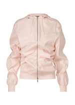 The GENERIC WEAR hoodie by ISSEY MIYAKE in light pink features ruched detailing on the body and sleeves, ribbed cuffs, a drawstring hood, and long-sleeve zip-up style, displayed against a white background. - LIGHT PINK （no.21）