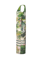 The ISSEY MIYAKE URBAN JUNGLE JERSEY is a sleeveless, long dress with a vibrant jungle greenery print featuring green palm leaves and foliage on a light background, shown in a side view.