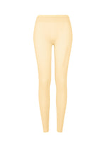 SLITS MESH AP seamless pale yellow leggings by ISSEY MIYAKE, shown from the front with a high waistband and no visible branding—ideal for layering or pairing with mesh knit pants. - EGG BEIGE （no.49）