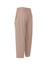The CAMPAGNE pants by ISSEY MIYAKE are light brown, high-waisted, cropped with an elastic waistband, side pockets, and wide straight legs. Made from stretchy fabric with visible seams, they're shown against a white background.