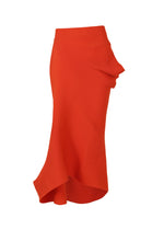 The ISSEY MIYAKE LIFE FORM is a high-waisted orange knit skirt crafted from recycled polyester, with a ribbed texture, asymmetrical hem, and side ruffle—easy care and shown on a white background. - MACAW RED （no.28）