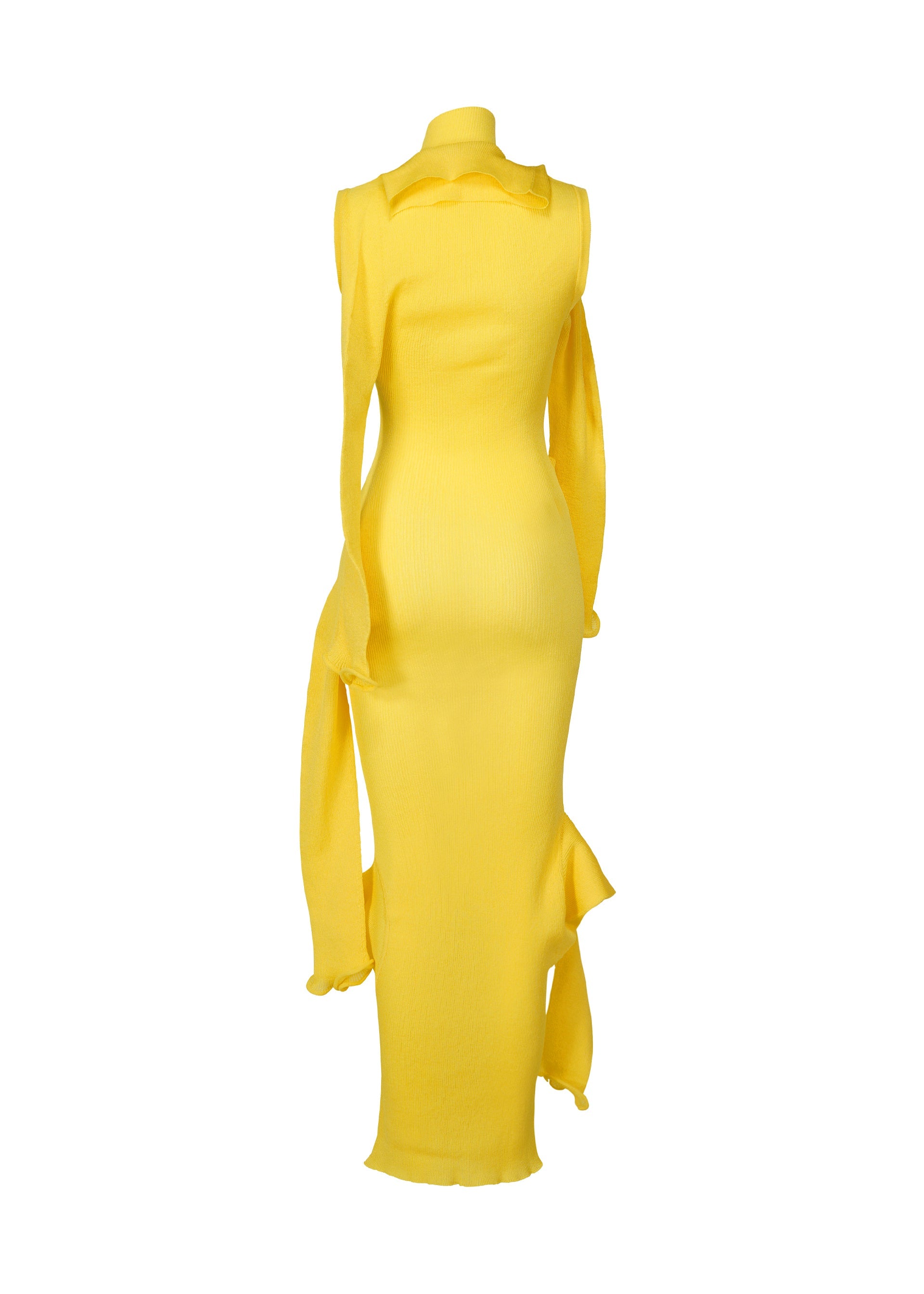 Zoomed view The ADVENTITIOUS：SLEEVES dress by ISSEY MIYAKE is a sleeveless, yellow knit gown with a high neckline, draped scarf accents on the right shoulder and left hip, and a floor-length hem, displayed on a mannequin against a white background.