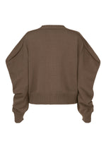 The AKIMBO KNIT by ISSEY MIYAKE is a brown, oversized long-sleeve sweater with ribbed cuffs, hem, and neckline, featuring a cozy puffy-shoulder silhouette and shown flat from the back.