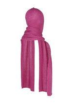 A mannequin head is wrapped in a long, bright pink ISSEY MIYAKE PANINI BALACLAVA, covering the face and neck for a cozy, balaclava-like effect.