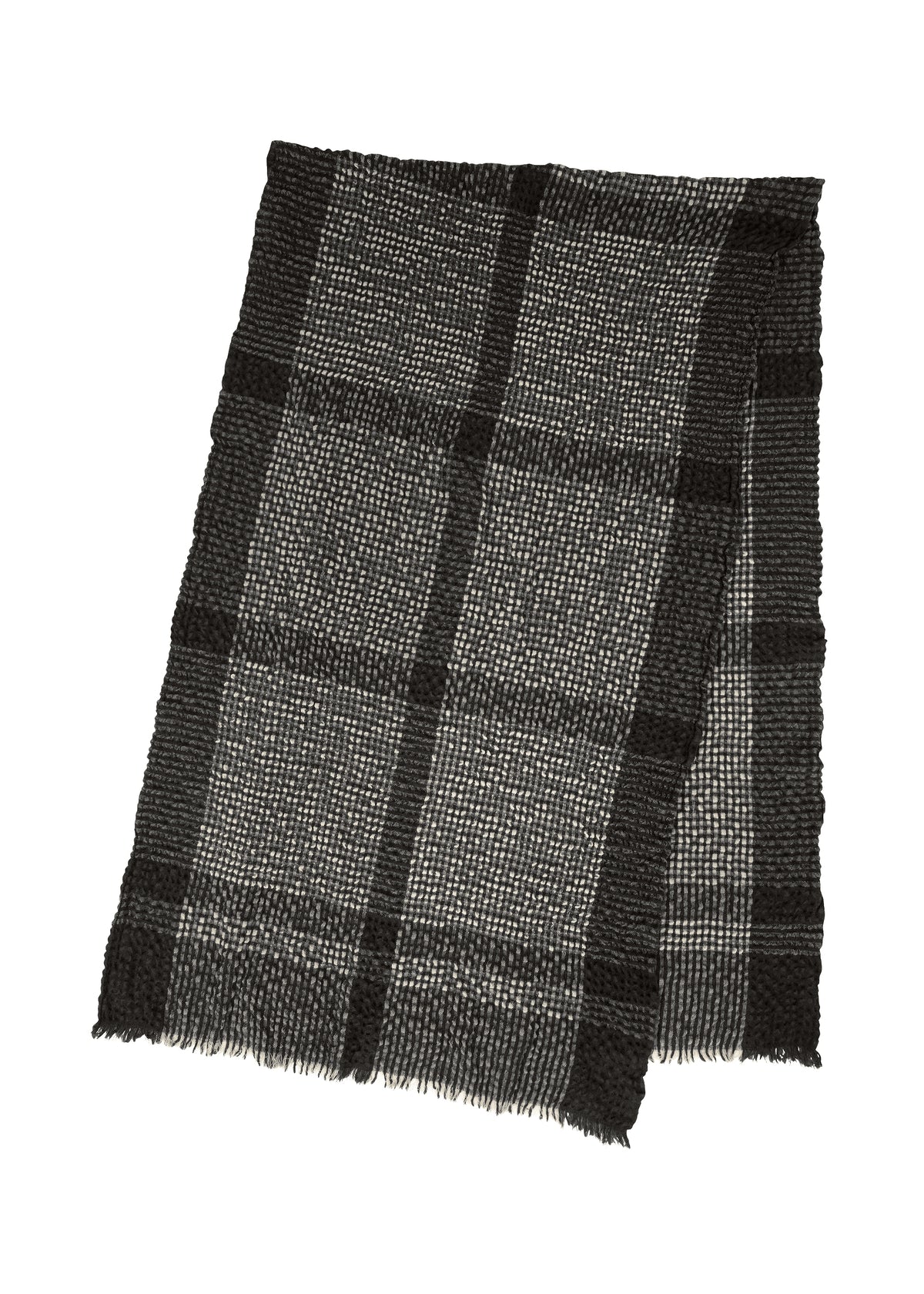 The BUMPY WOOL STOLE by ISSEY MIYAKE, a black and gray cashmere-blend accessory with a plaid pattern, subtly bumpy texture, and fringed edges, is laid flat on a white background. view 4 of 5