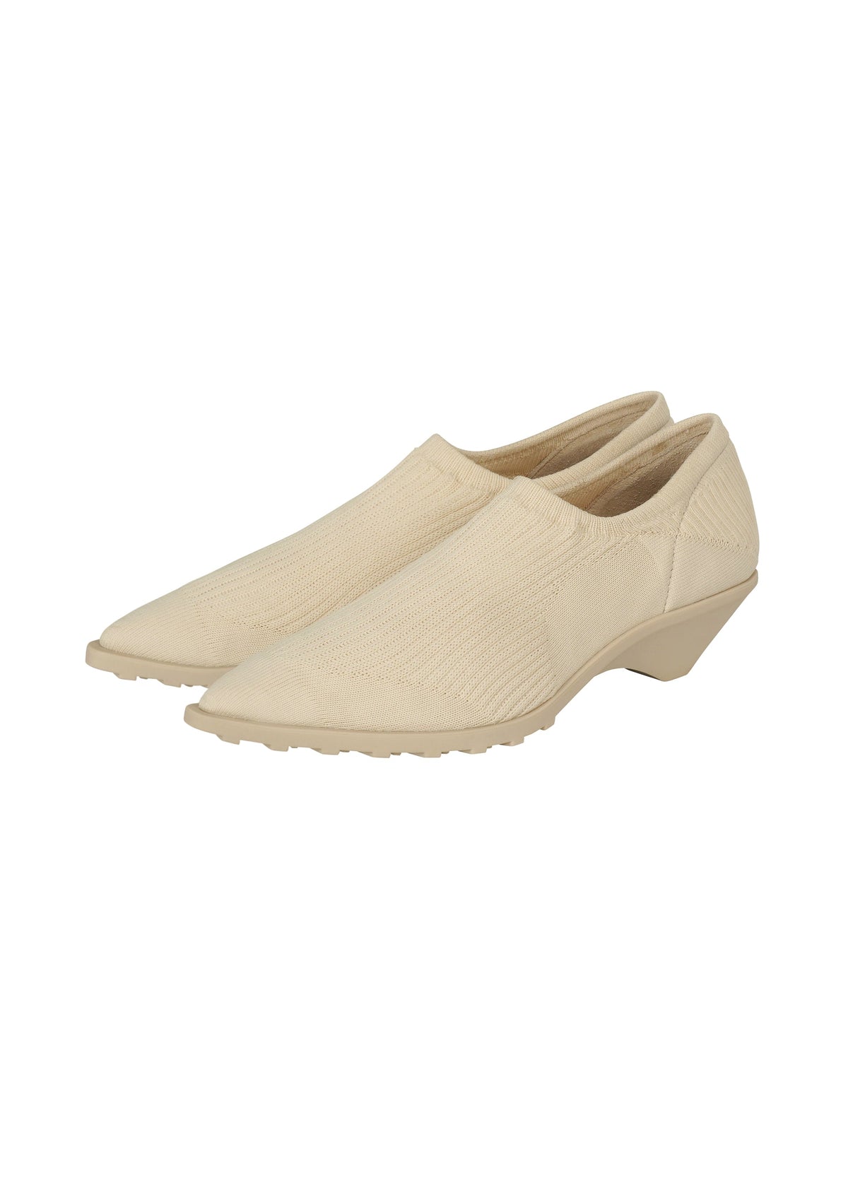 The ANNA slip-on shoes by ISSEY MIYAKE feature a beige textured knit fabric, pointed toes, and low wedge heels, delivering the comfort of sock-like footwear. view 2 of 9