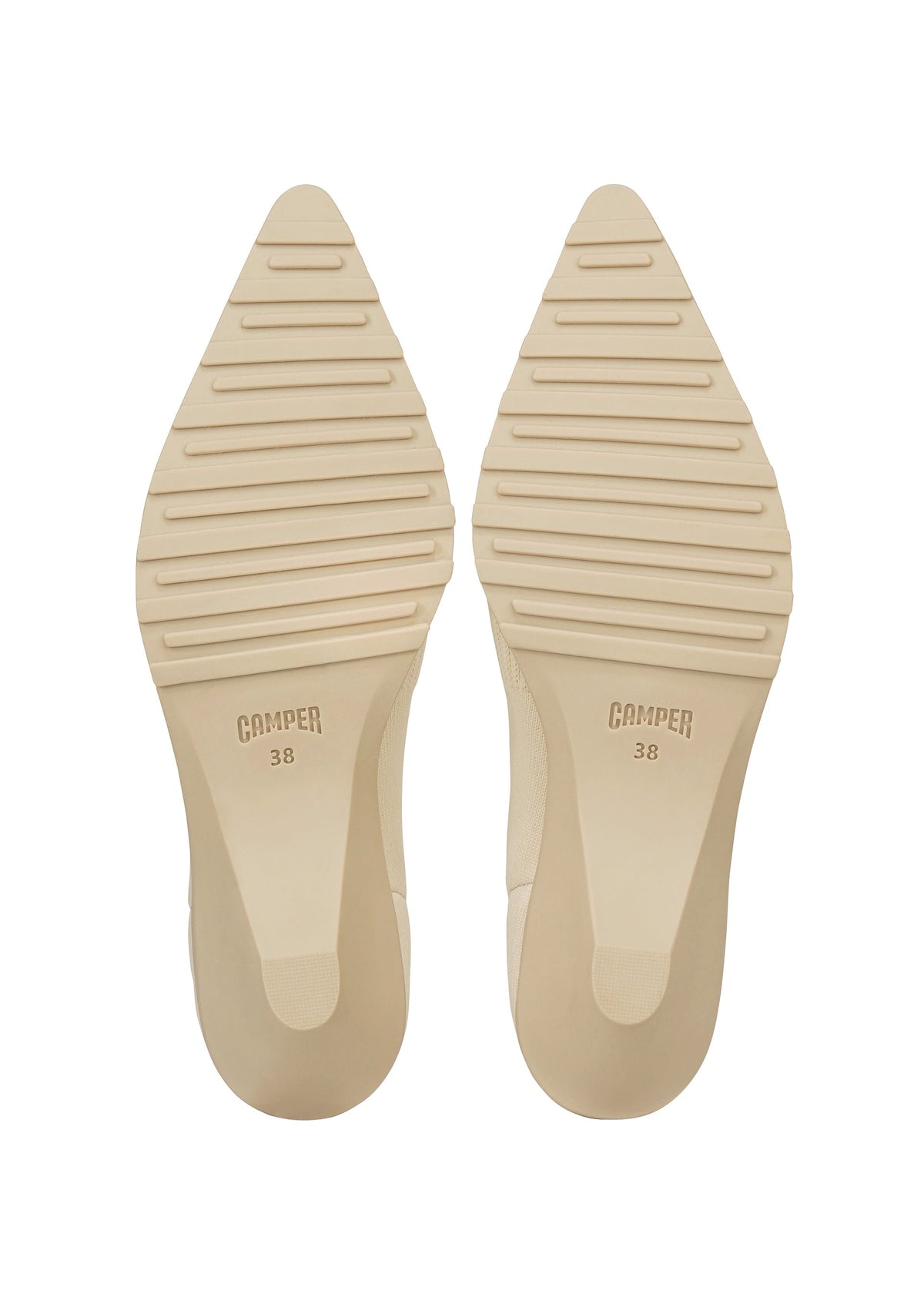 Two beige pointed shoe soles with horizontal grooves and the brand ISSEY MIYAKE 38 stamped on each sole, shown against a white background—these soles are designed for the ANNA range, renowned for its innovative knitted footwear and sock-like shoes. view 6 of 9