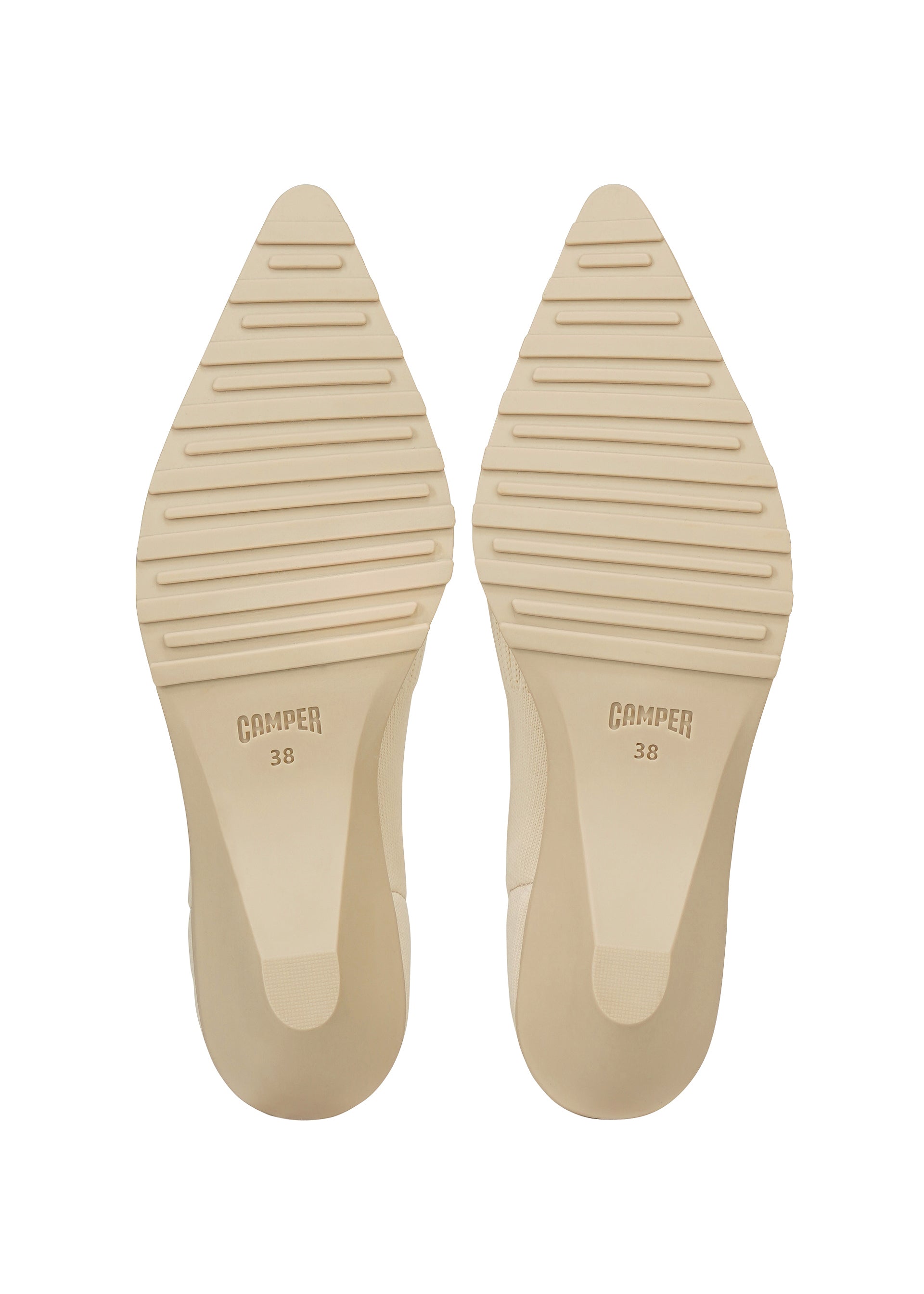 Zoomed view Two beige pointed shoe soles with horizontal grooves and the brand ISSEY MIYAKE 38 stamped on each sole, shown against a white background—these soles are designed for the ANNA range, renowned for its innovative knitted footwear and sock-like shoes.