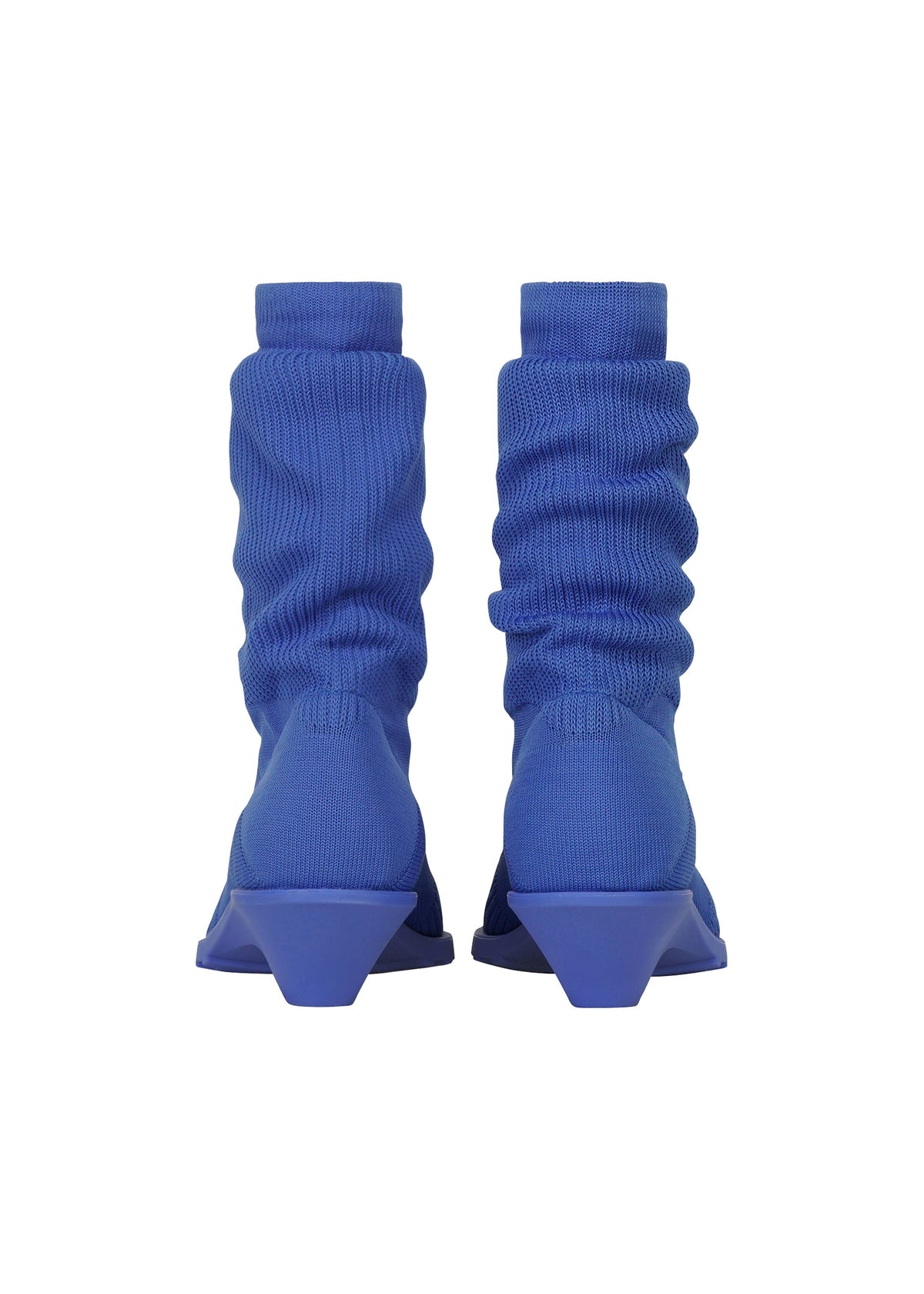 A pair of ISSEY MIYAKE ANNA blue ribbed sock-like boots with geometric, angular heels—reminiscent of knitted footwear—shown from the back against a white background. view 5 of 11