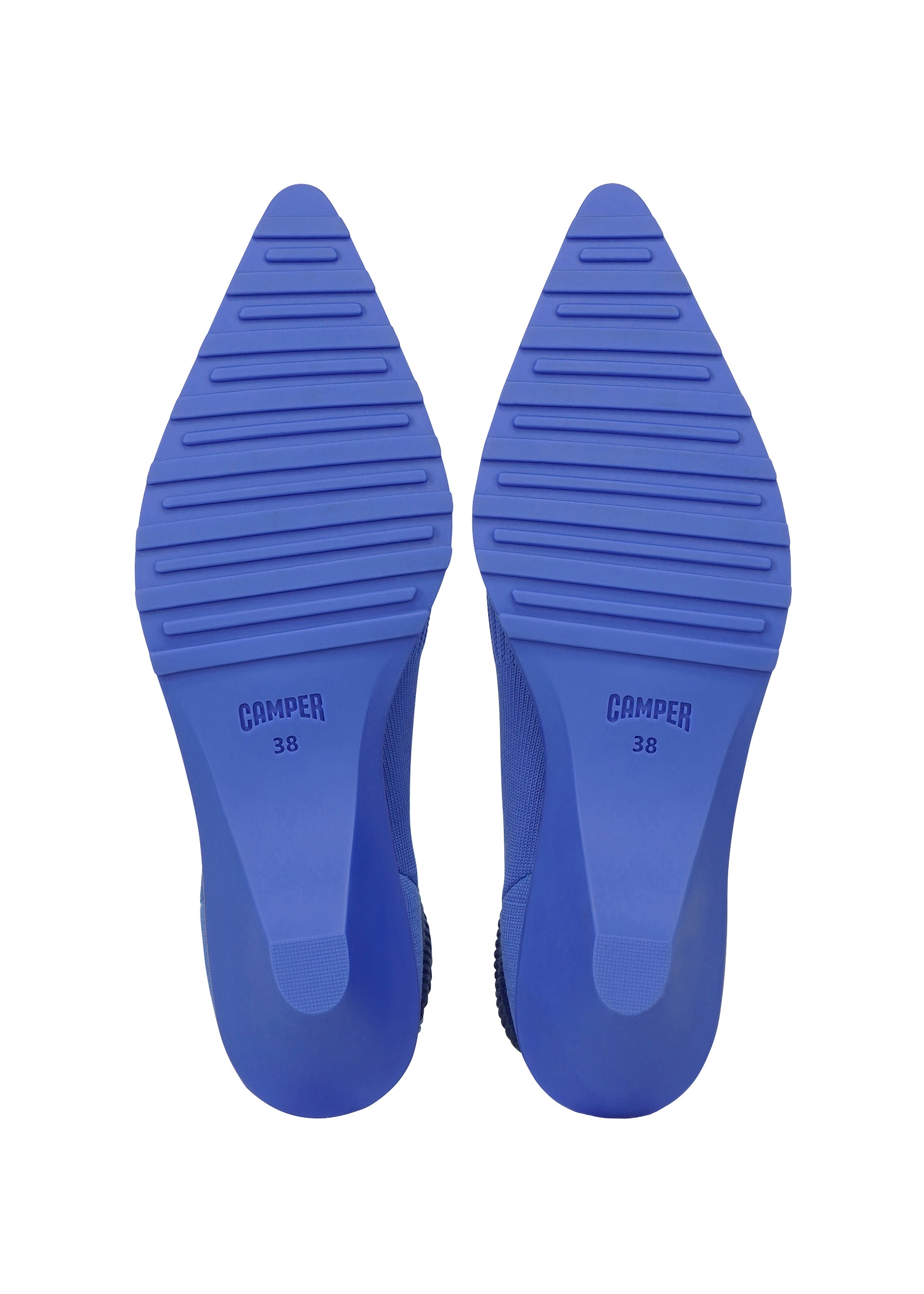 Zoomed view Pair of blue pointed shoe soles with horizontal grooves, ISSEY MIYAKE 38 printed on each sole, viewed from the bottom against a white background—designed for the ANNA shoes by ISSEY MIYAKE, these soles enhance both comfort and the modern appeal of this knitted footwear.