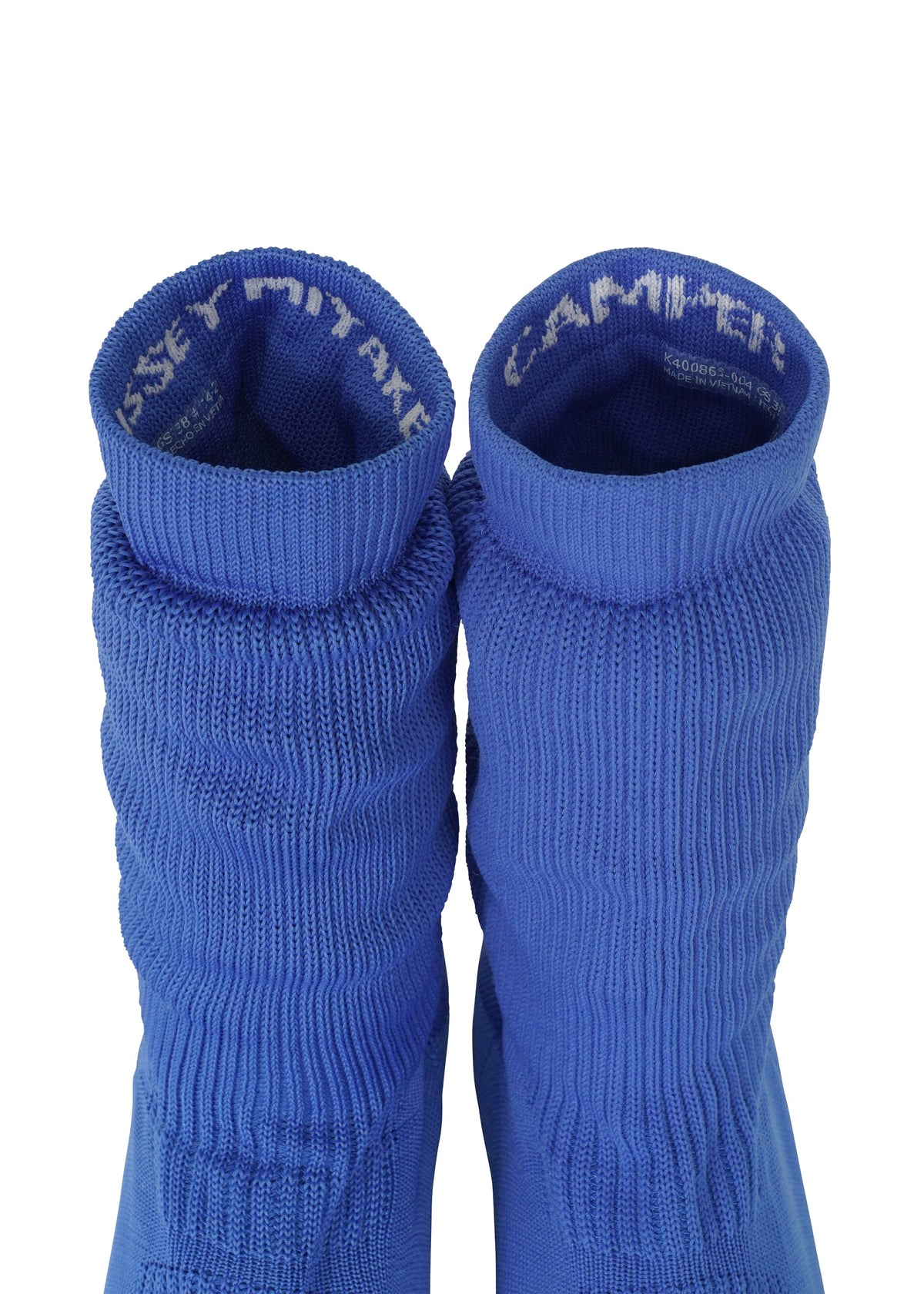 Two blue ribbed knit socks from ISSEY MIYAKE’s ANNA collection are positioned side by side, viewed from above. Reminiscent of stylish knitted footwear, the inside cuffs display partially visible white text. The background is plain white. view 8 of 11