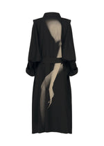 The HANDS OF LOVER coat by ISSEY MIYAKE is a black long coat made from durable poplin fabric, distinguished by a large abstract beige graphic of a bent arm and hand silk-screened with discharge printing on the back.