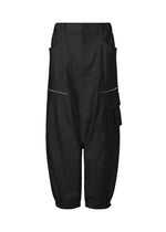 ISSEY MIYAKE's GRAINY PANTS are black, high-waisted, wide-leg cropped cargo sarouel pants made from stretch cotton with a front zipper, side pockets, and a flap pocket with button on one leg, shown on a white background. - BLACK （no.15）