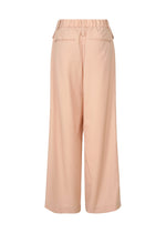Back view of the LUSTROUS WOOL PANTS by ISSEY MIYAKE in peach, featuring a wide-leg silhouette crafted from a wrinkle-resistant wool blend. These relaxed-fit pants offer an elastic waistband, two welt pockets, and a straight hem, and are hand-washable for easy care.