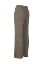 HATCHING PLEATS by ISSEY MIYAKE: taupe, high-waisted wide-leg pleated straight pants with a crinkled textured finish, shown from the side against a plain white background.