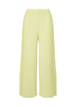 HATCHING BOTTOMS by ISSEY MIYAKE are light yellow pleated wide pants featuring an elastic waistband and a subtle textured finish, crafted from soft polyester and displayed against a plain white background. - DULL CREAM （no.50）