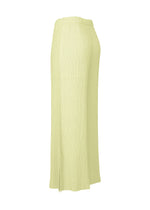 The HATCHING BOTTOMS skirt by ISSEY MIYAKE is a light yellow, ankle-length piece featuring a crinkled, hatching texture, an elastic waistband, and a side slit, displayed from a side angle against a plain white background.