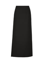 The CALLIGRAPH skirt by ISSEY MIYAKE is a long, straight black piece featuring a high waist and a subtle side slit. Expertly tailored from worsted wool in refined ISSEY MIYAKE style, its simple and elegant design is free of visible embellishments or patterns. - BLACK （no.15）
