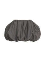 The REFLECTION oversized clutch bag by ISSEY MIYAKE features a dark gray reflector fabric cover and a ruched, gathered design, displayed against a white background.
