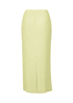 HATCHING BOTTOMS by ISSEY MIYAKE: Ankle-length, light yellow ribbed skirt featuring a straight cut and subtle back slit, crafted from soft polyester for a comfortable textured finish, shown on a white background.