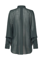 The SHEER WOOL by ISSEY MIYAKE is a dark green, long-sleeved sheer shirt with a stand collar, wide buttoned cuffs, and a central vertical seam seen from the back.